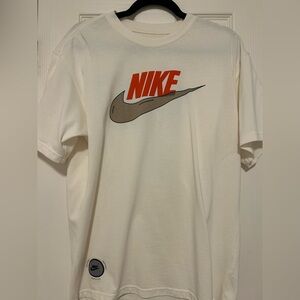 Nike Men's Off-White Graphic Logo Tee with Orange & Brown Print